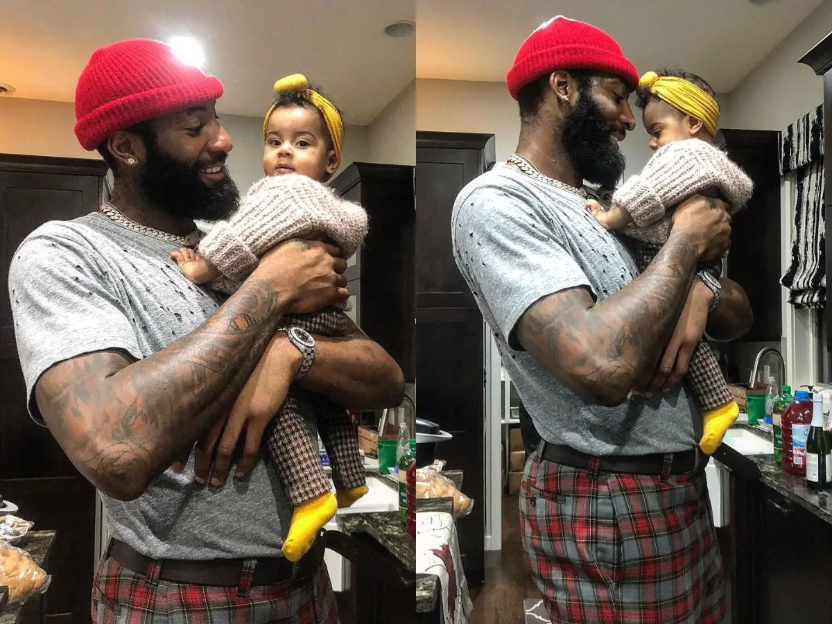 Andre holding Aubrey on her first's birthday at home in March 2020