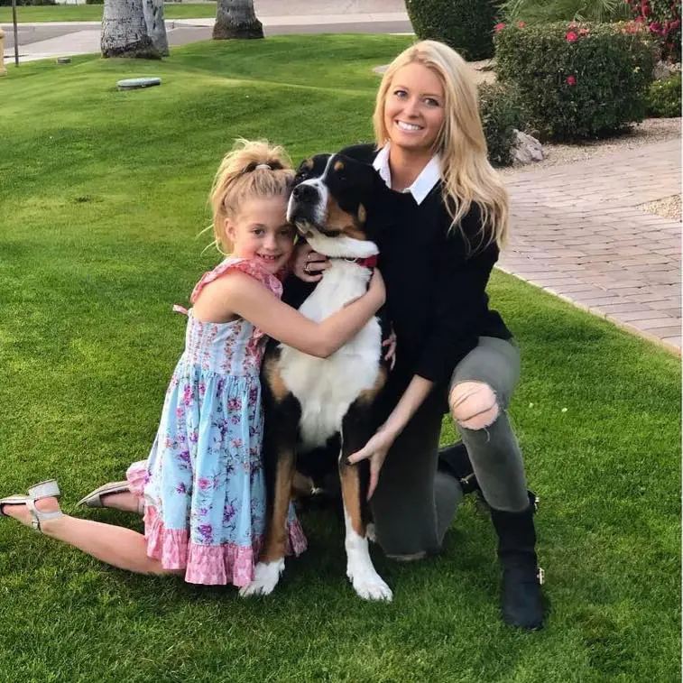 Taitym and Halleigh playing with their pet dog in January 2019 on her birthday