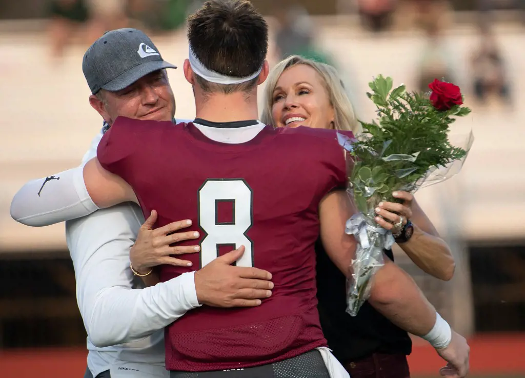 Zak hugged his parents Krik and Alison during Senior Night ceremonies at Montgomery Bell Academy in September 2020