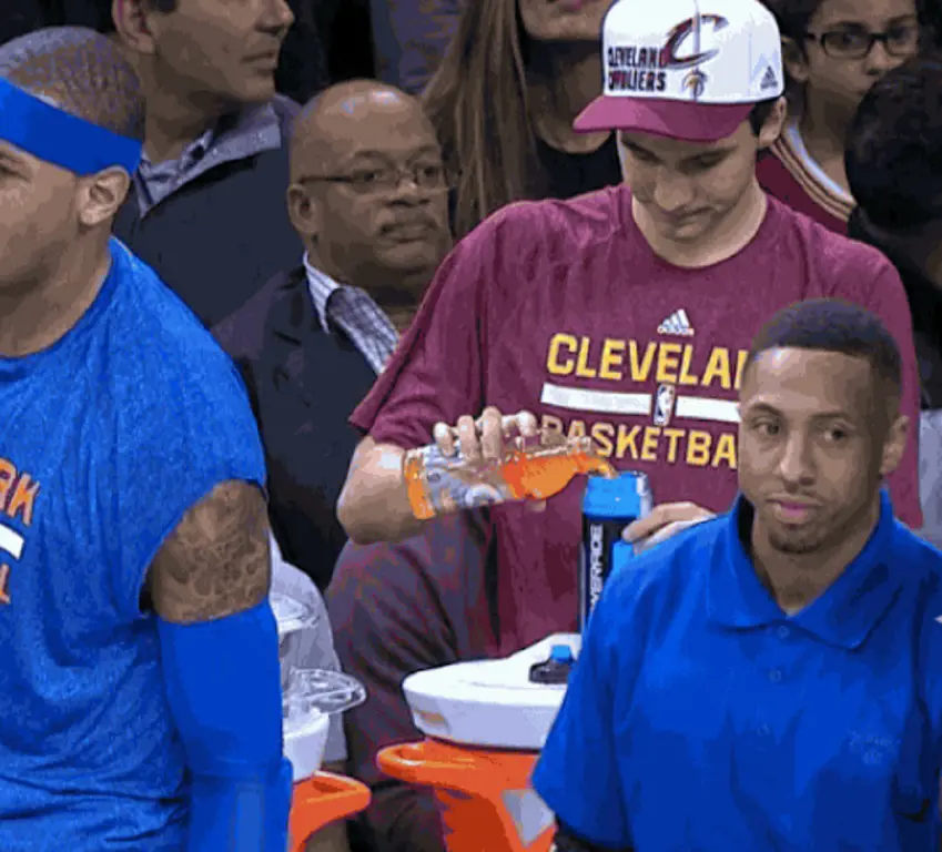 Cleveland Cavaliers waterboy filling bottle.