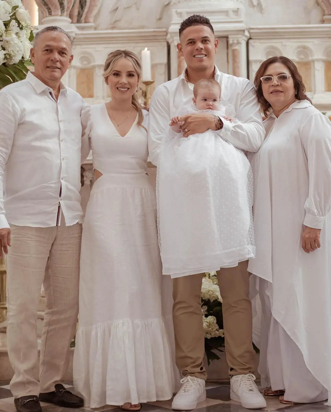Alvaro and Uldy Urshela attending their granddaughter's baptism