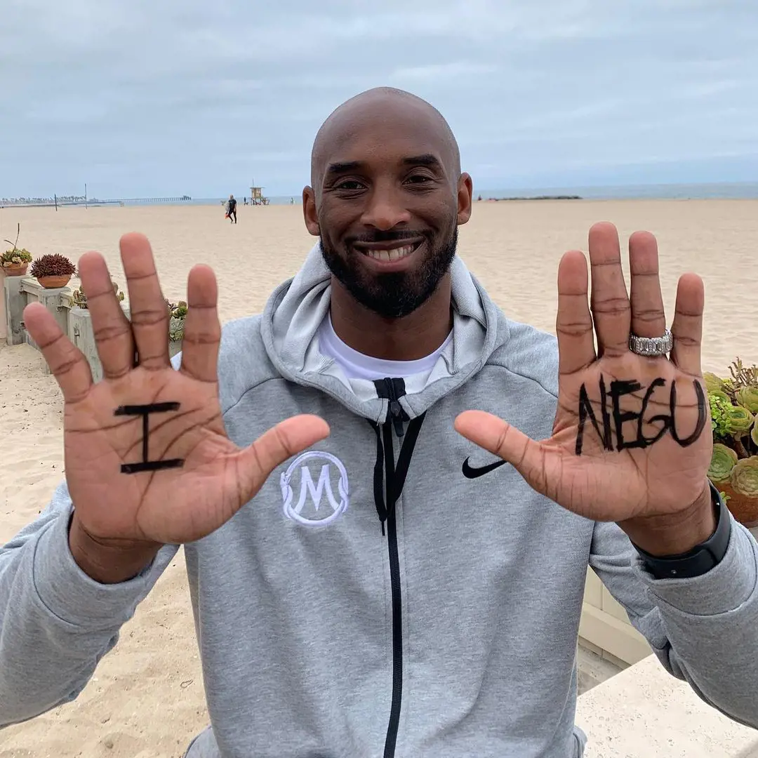 Kobe Bryant doing the NEGU hands challenge for childhood cancer awareness in 2019