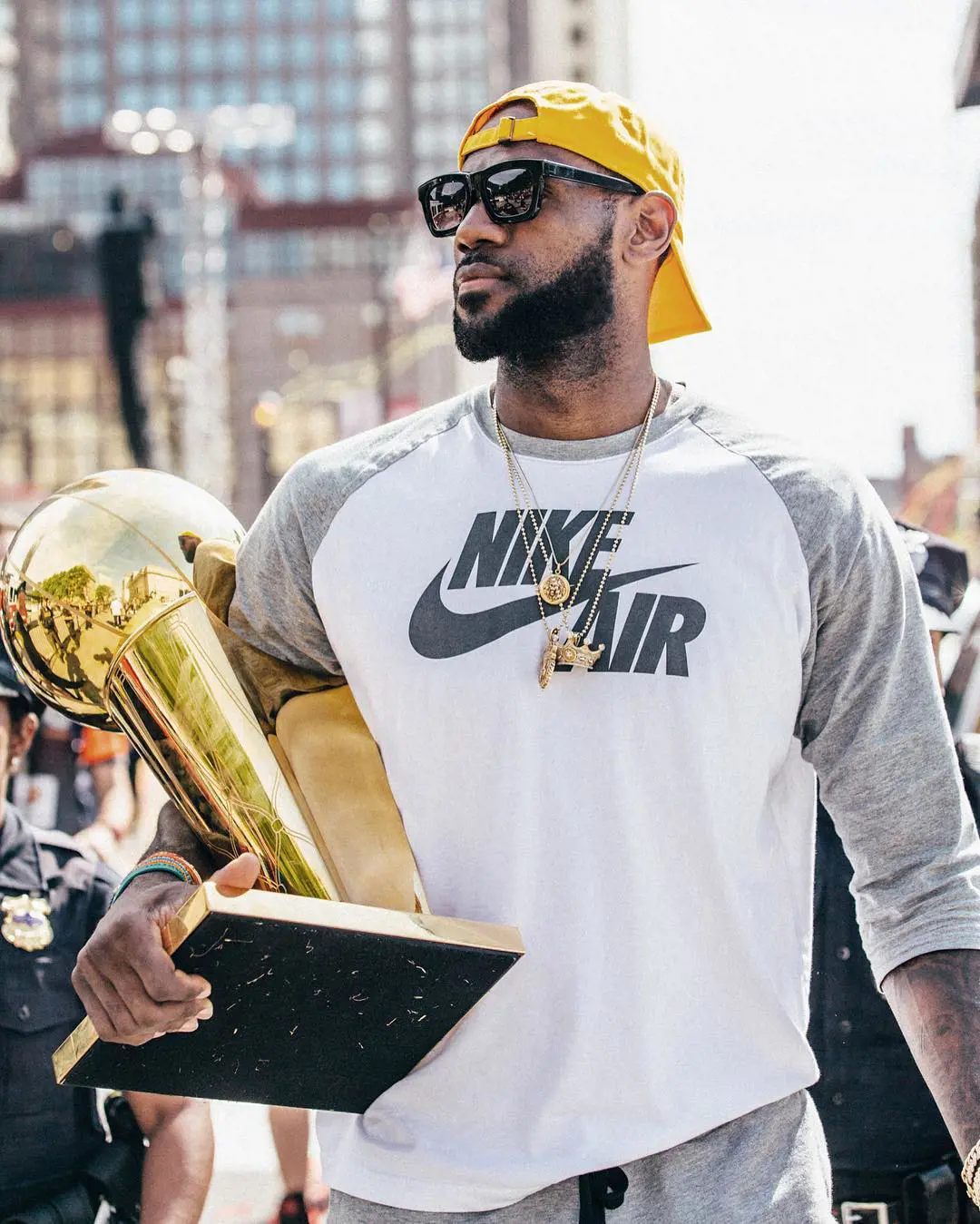 LeBron James holds his championship trophy while sporting a Nike Air t-shirt