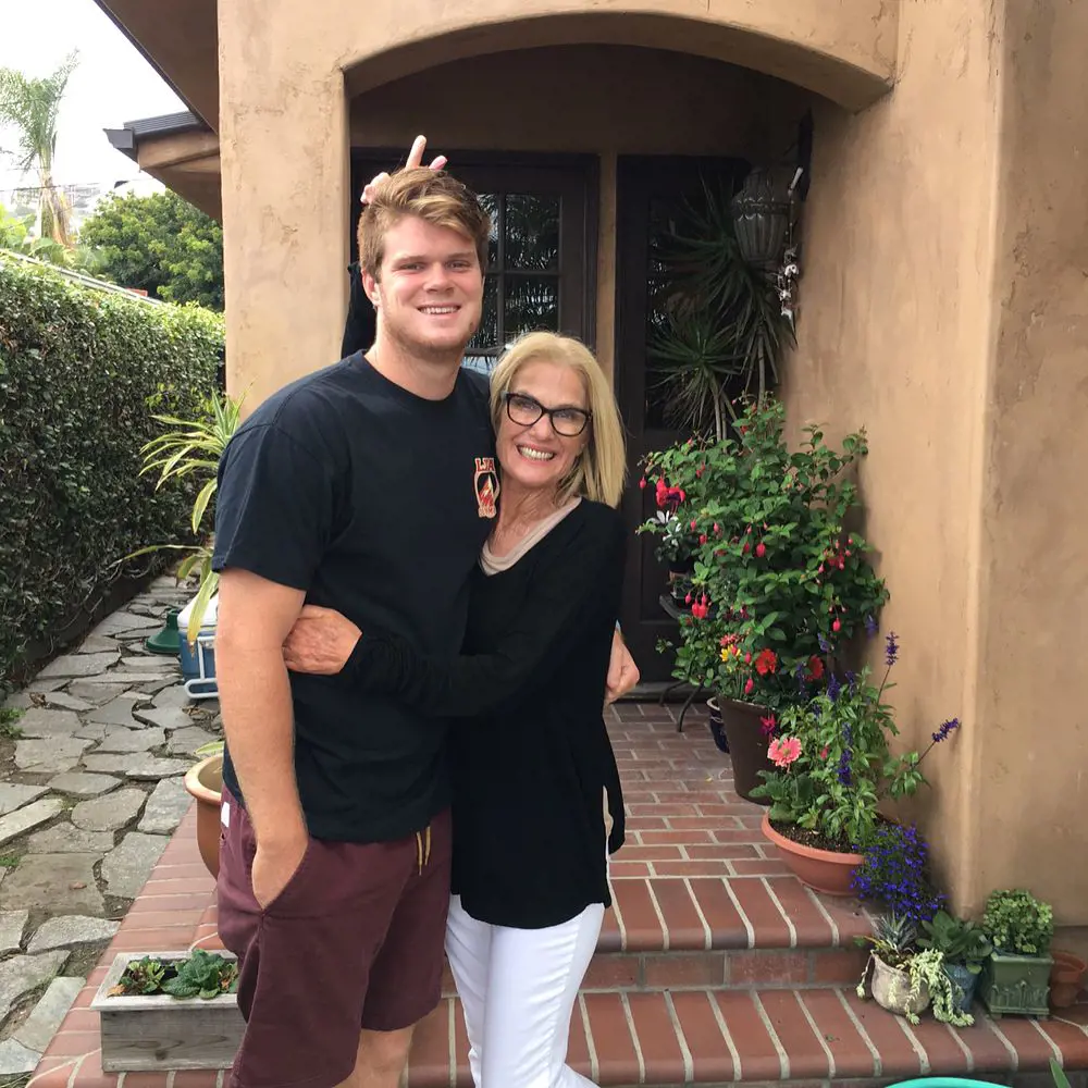 Chris hugging her son Sam near their house in May 2017