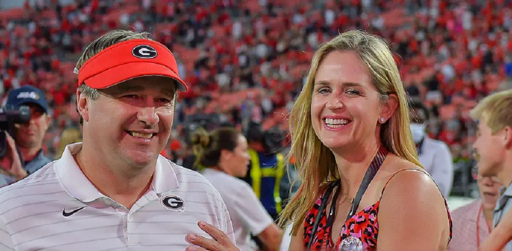 Kirby shares happy moment with Mary following game between Kentucky Wildcats and Georgia Bulldogs at Sanford Stadium in Athens. (Photo by:Rich von Biberstein)