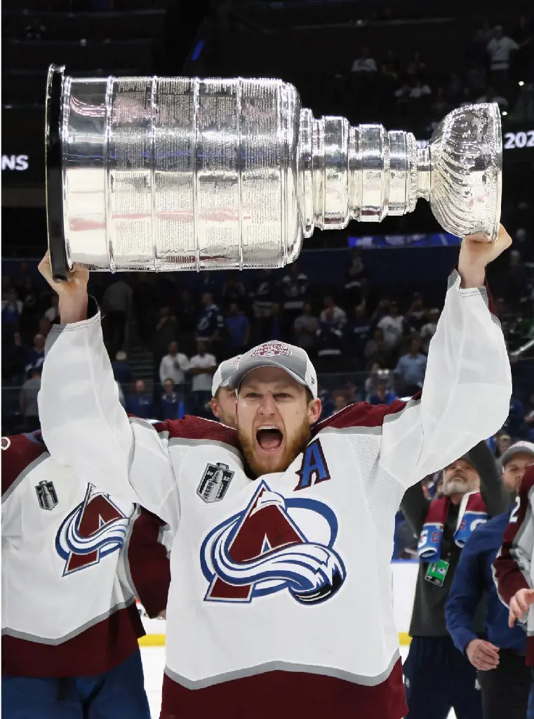 Nathan MacKinnon carries the Stanley Cup of the 2022 NHL Stanley Cup Final at Amalie Arena on June 26, 2022 in Tampa