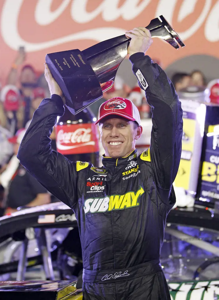 Edwards lifting the trophy in Victory Lane on May 24, 2015.