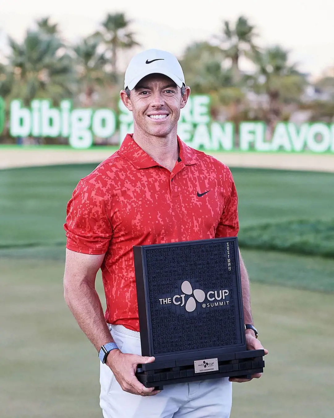 Rory clutching The CJ Cup while donning Nike logoed attire on October 18, 2021