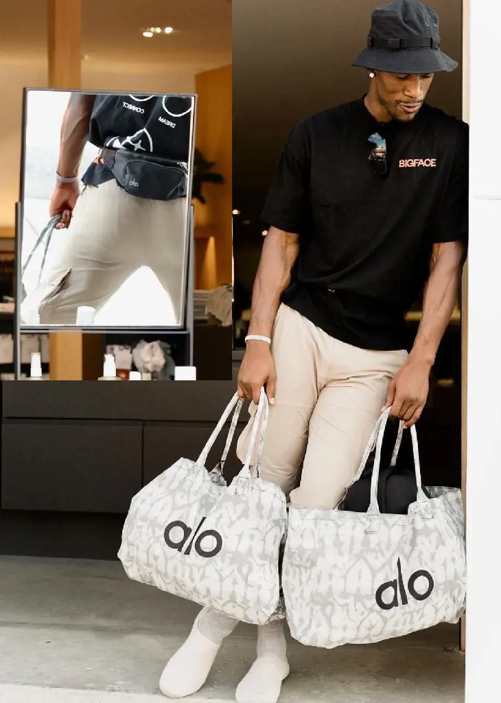 Jimmy at Alo's store holding the brand logoed bag in 2022